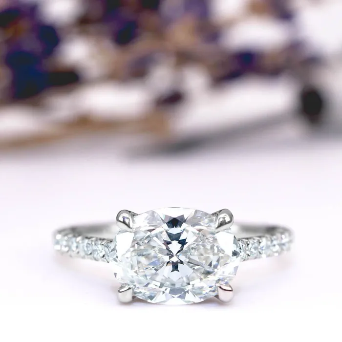 East West Engagement Ring with Hidden Lab Grown Diamond Pave Halo deBebians Rings